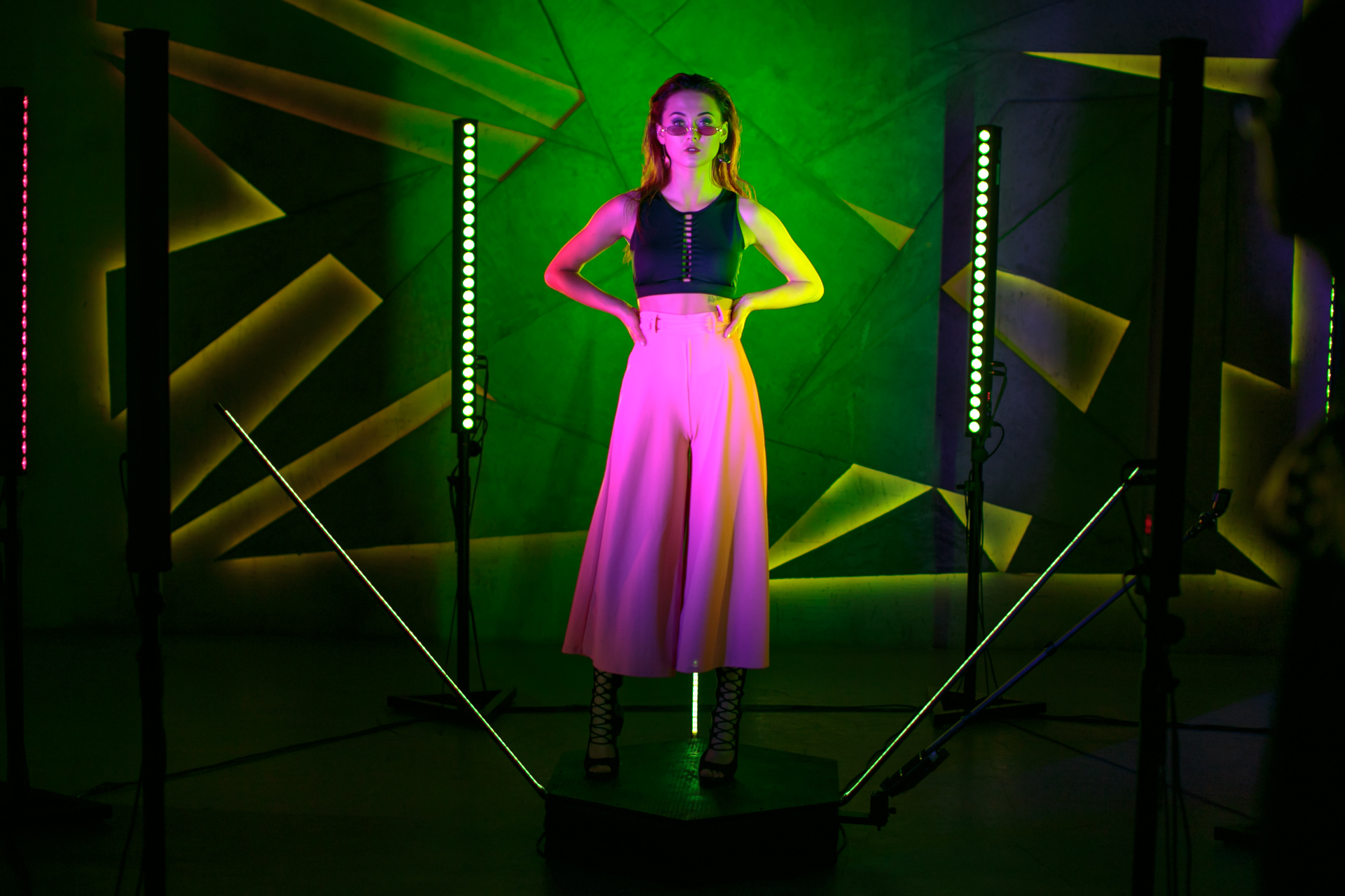 360 photo booth with green and pink neon lights